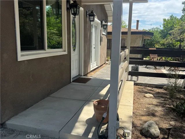 a view of a balcony with chairs