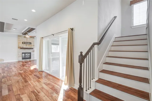 a view of entryway with wooden floor and stairs