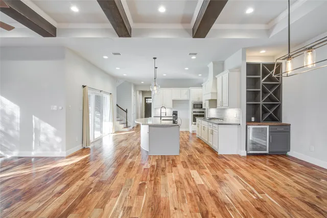 a utility room with cabinets and washer
