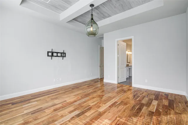 a spacious bathroom with a granite countertop sink mirror and shower