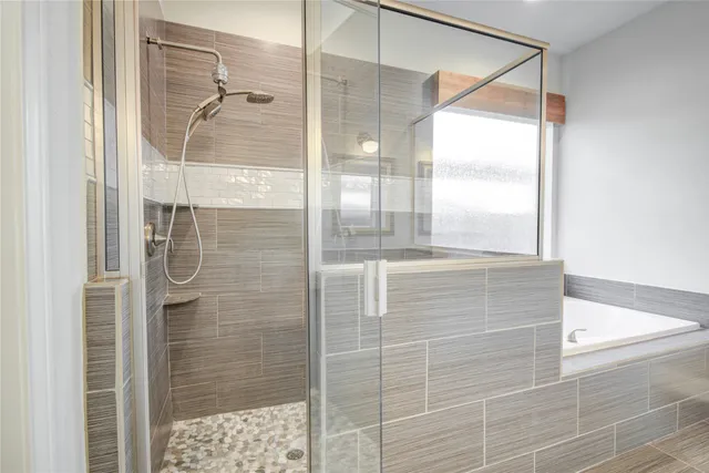 a spacious bathroom with a granite countertop sink mirror and a