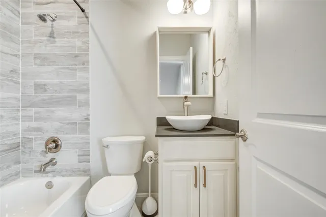 a bathroom with a toilet and a bathtub