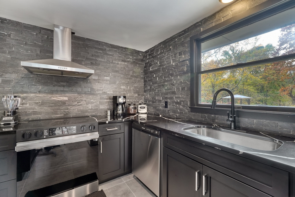 38 Appleton Street Saugus, MA 01906 - Photo 11 of 38 a sink with granite countertop a stove top oven