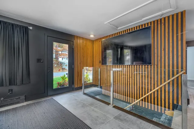 a view of a room with wooden stairs