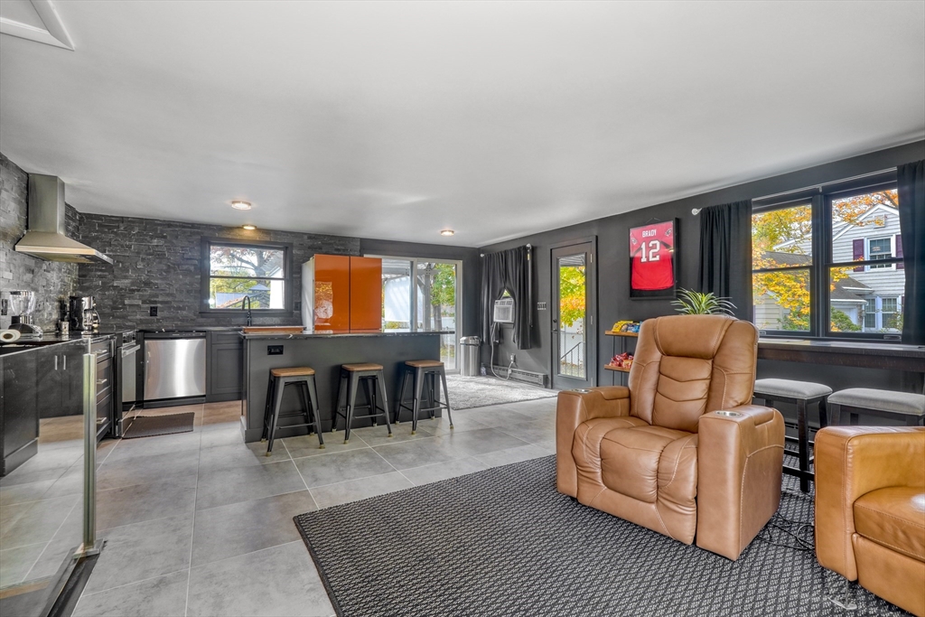 38 Appleton Street Saugus, MA 01906 - Photo 3 of 38 a living room with furniture a window and a flat screen tv