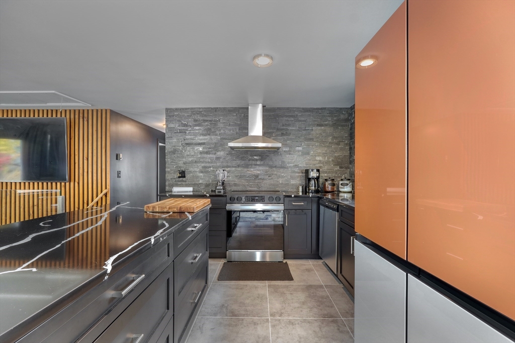 38 Appleton Street Saugus, MA 01906 - Photo 8 of 38 a kitchen with stainless steel appliances granite countertop a sink and stove