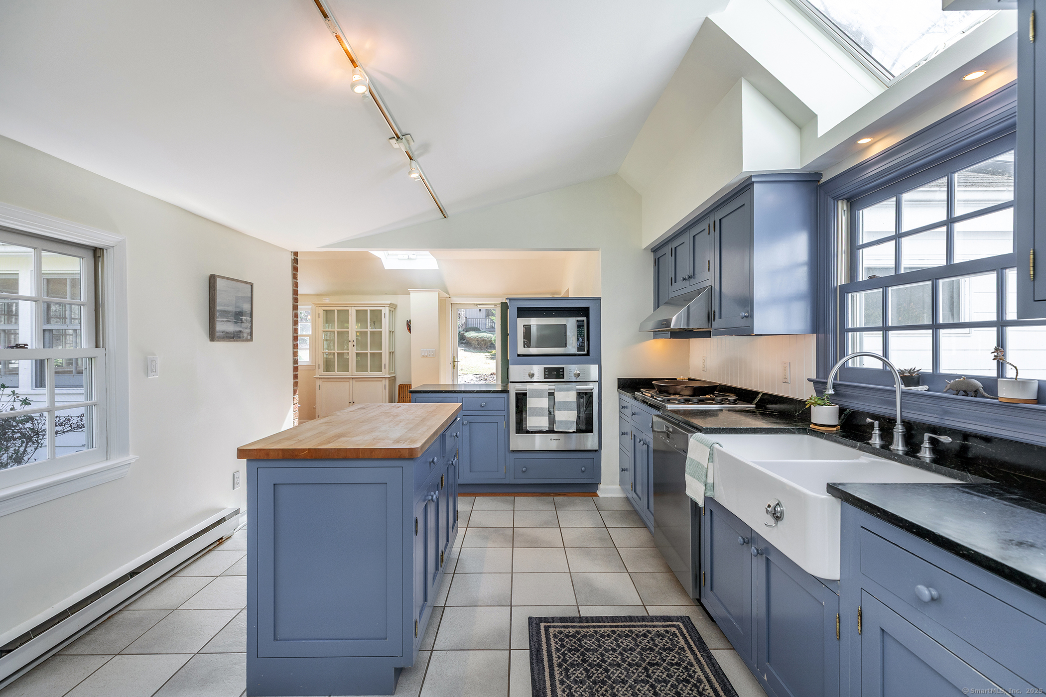 40 Camps Flat Road Kent, CT 06785 - Photo 13 of 26 a large kitchen with stainless steel appliances granite countertop a stove and a sink
