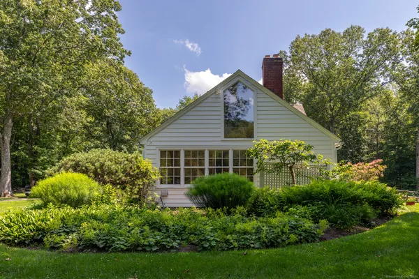 a view of a house with garden and plants