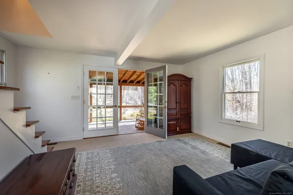 a living room with furniture and a window