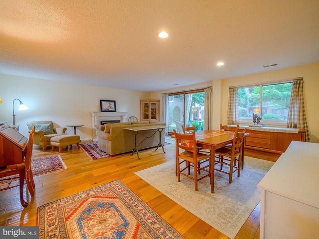 a kitchen with stainless steel appliances granite countertop a sink a stove and cabinets