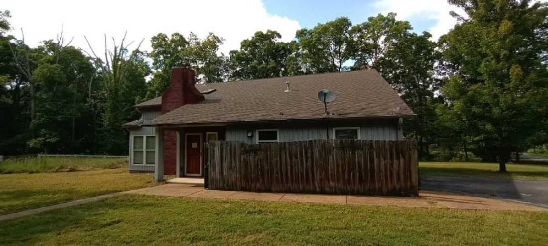 2600 Center Point Road South Reagan, TN 38368 - Photo 1 of 24 a view of a white house with a small yard and large trees