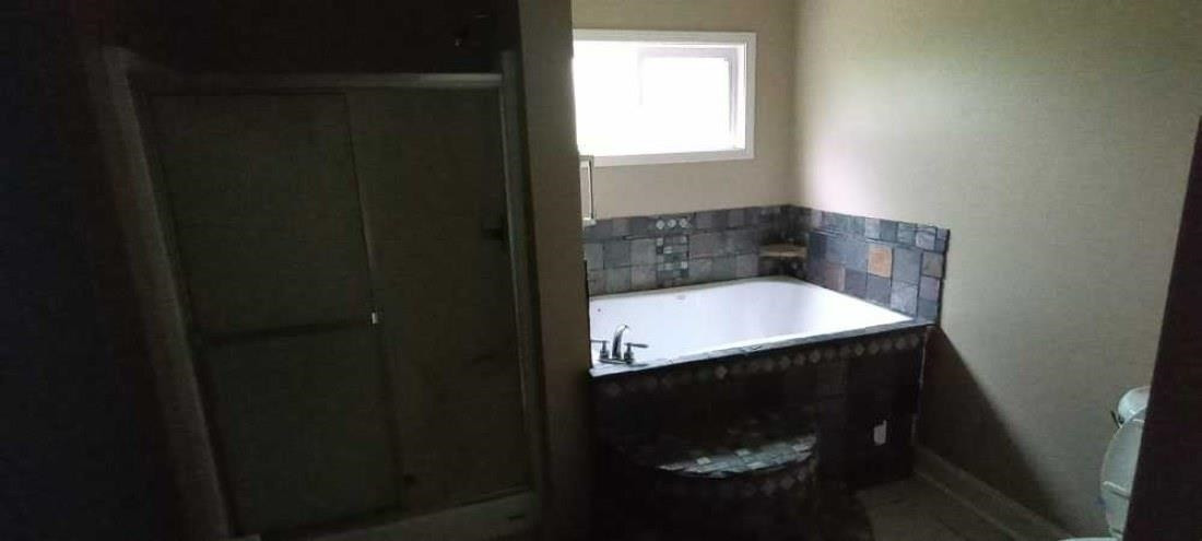 2600 Center Point Road South Reagan, TN 38368 - Photo 14 of 24 a bathroom with a sink and mirror