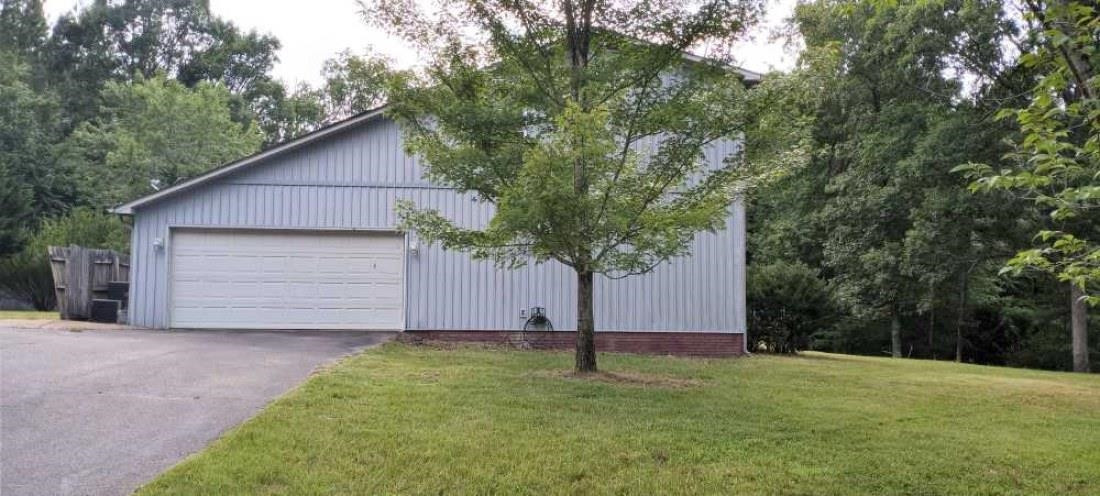 2600 Center Point Road South Reagan, TN 38368 - Photo 2 of 24 a house with trees in front of it
