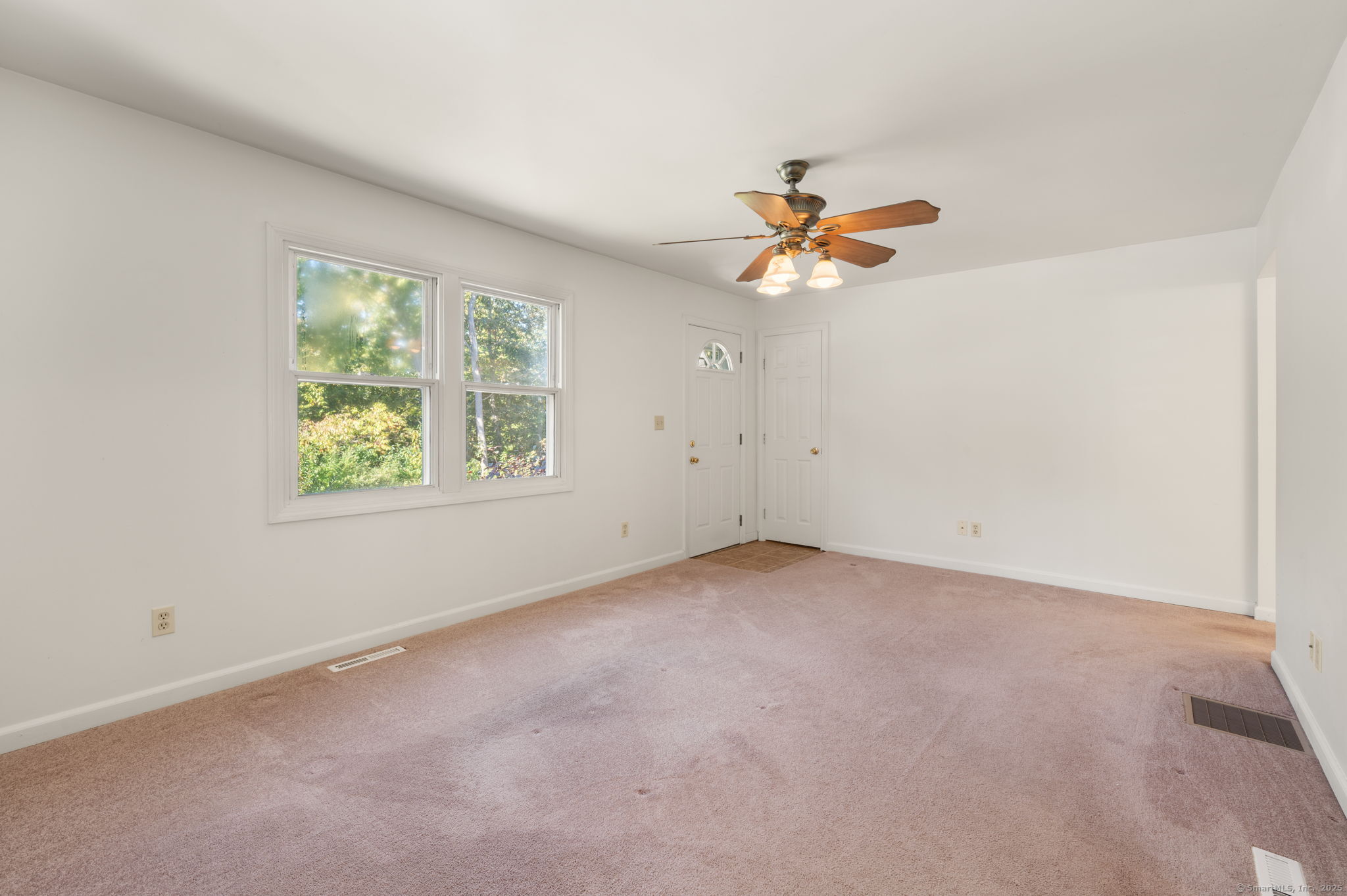 6 Sunset Road Gales Ferry, CT 06335 - Photo 9 of 23 an empty room with a window and a fan