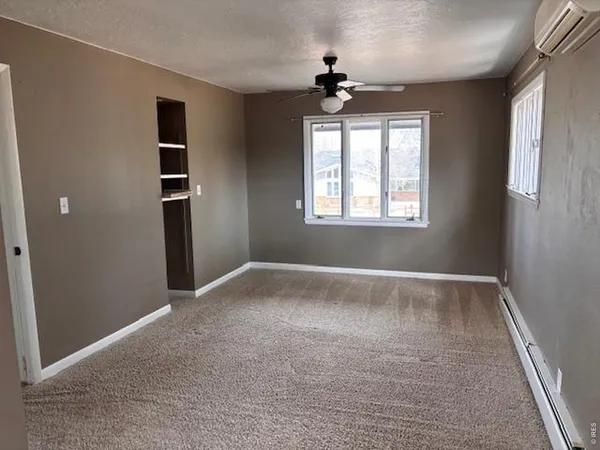 a view of empty room with windows