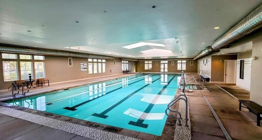 43885 Arancia Way Indio, CA 92203 - Photo 18 of 22 a view of a patio with table and chairs with wooden floor and fence