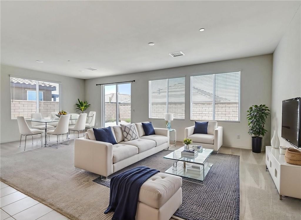43885 Arancia Way Indio, CA 92203 - Photo 5 of 22 a living room with furniture and a large window