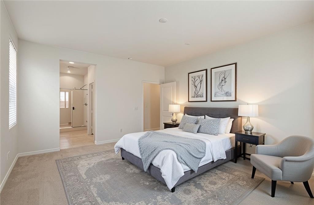 43885 Arancia Way Indio, CA 92203 - Photo 8 of 22 a bedroom with a bed and chair