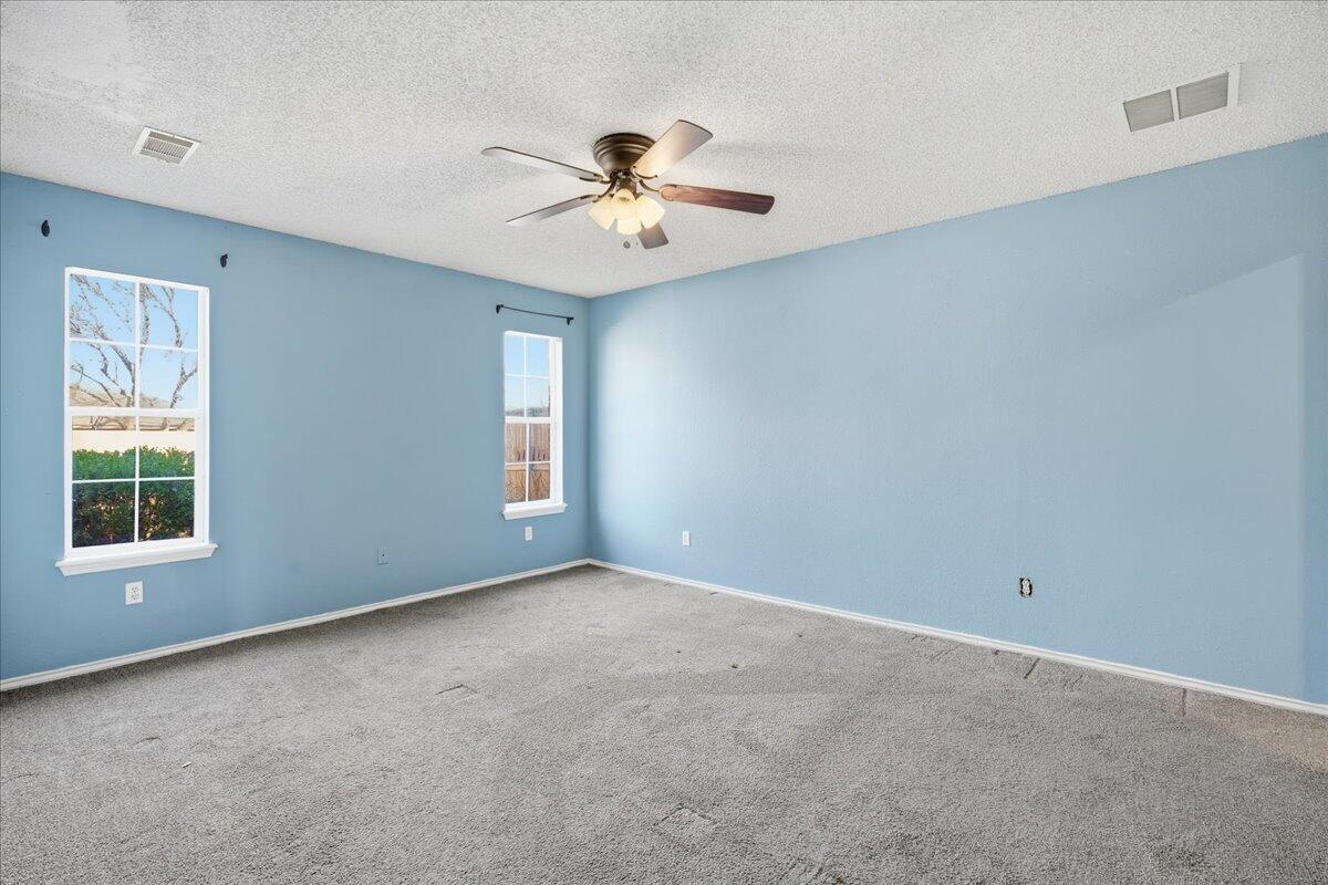 6214 6th Street Lubbock, TX 79416 - Photo 11 of 21 a view of an empty room with a window