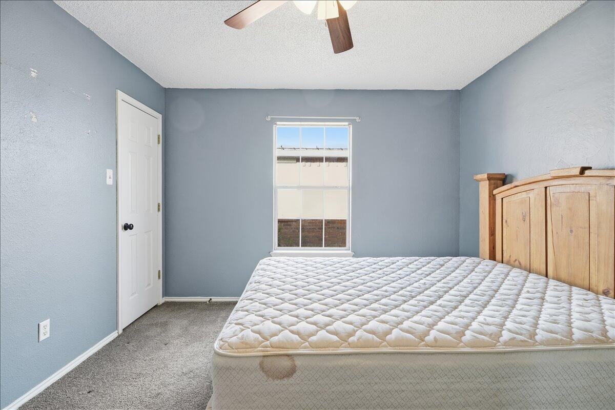 6214 6th Street Lubbock, TX 79416 - Photo 16 of 21 a bedroom with a bed and window