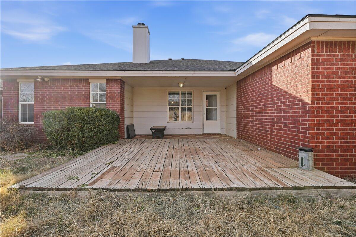 6214 6th Street Lubbock, TX 79416 - Photo 18 of 21 a front view of a house with garden
