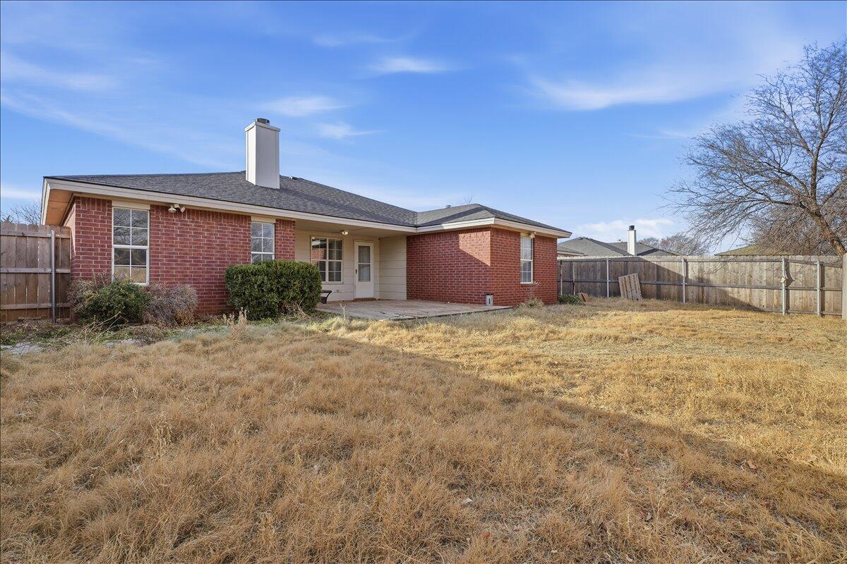 6214 6th Street Lubbock, TX 79416 - Photo 21 of 21 a front view of a house with garden