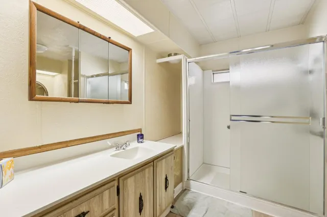 a bathroom with a double vanity sink and mirror