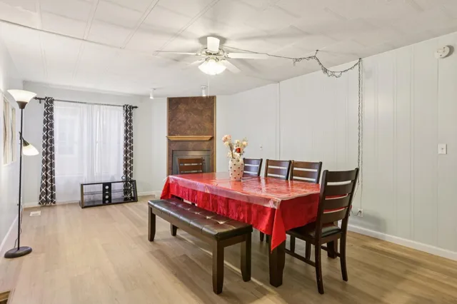 a dining room with a table chairs and bedroom view