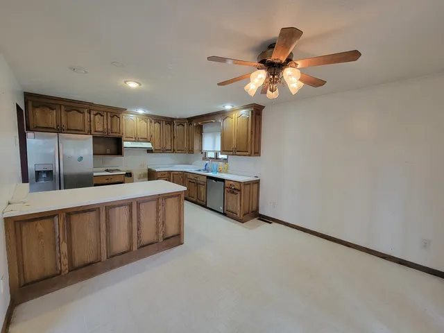 a spacious bathroom with a double vanity sink and a mirror