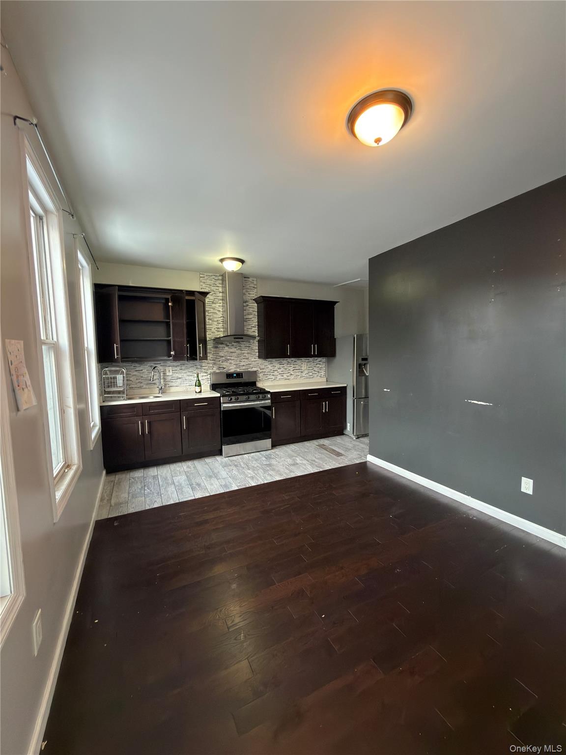 31-45 84th Street, Unit 2 Queens, NY 11370 - Photo 4 of 5 a view of kitchen with microwave and stove