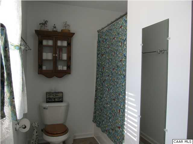 448 Rockfish Run Road Scottsville, VA 24590 - Photo 15 of 27 a bathroom with a toilet and a sink