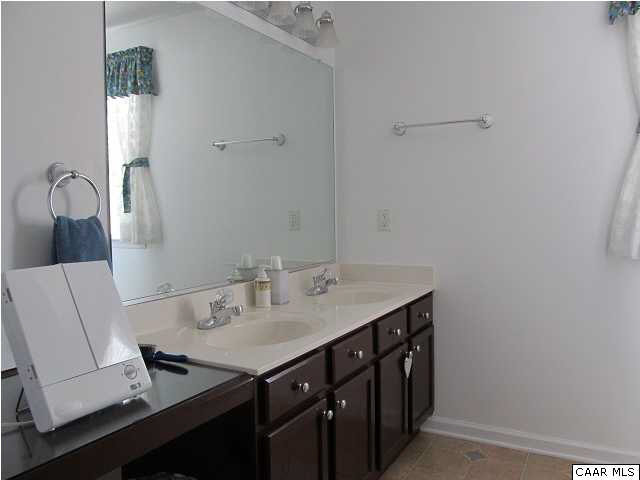 448 Rockfish Run Road Scottsville, VA 24590 - Photo 16 of 27 a bathroom with a sink a vanity and a mirror