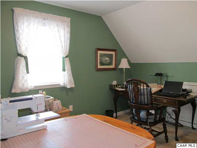 448 Rockfish Run Road Scottsville, VA 24590 - Photo 20 of 27 a bedroom with a bed and a window