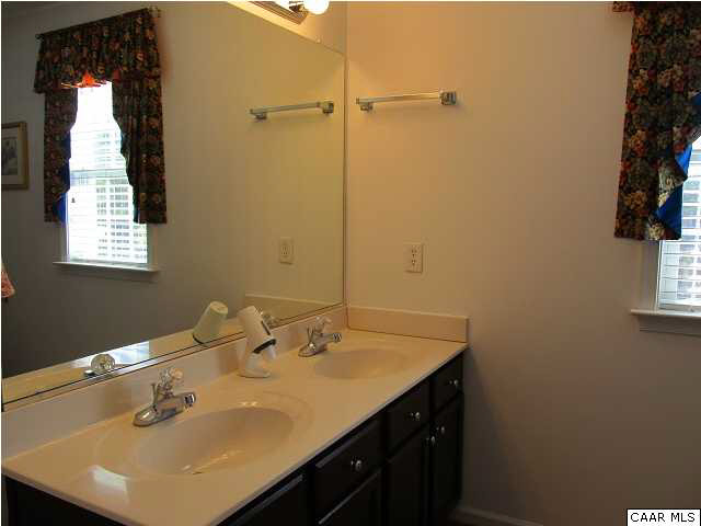 448 Rockfish Run Road Scottsville, VA 24590 - Photo 21 of 27 a bathroom with a sink and a mirror