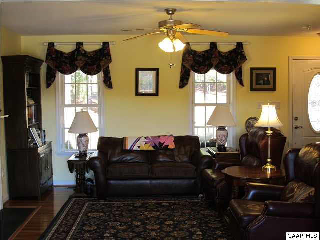 448 Rockfish Run Road Scottsville, VA 24590 - Photo 8 of 27 a living room with furniture and a fireplace