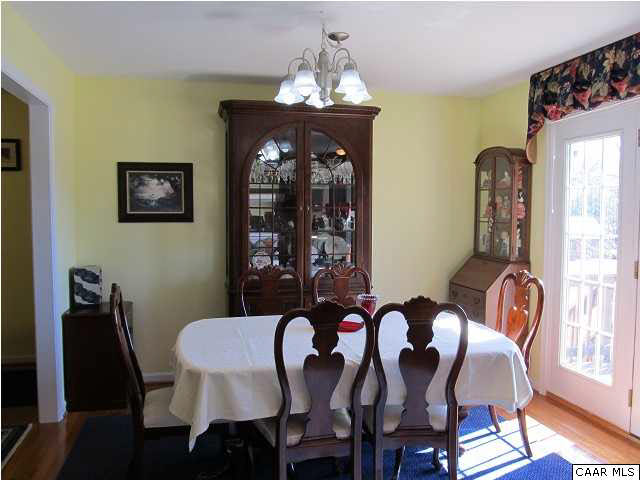 448 Rockfish Run Road Scottsville, VA 24590 - Photo 10 of 27 a view of a dining room with furniture and chandelier