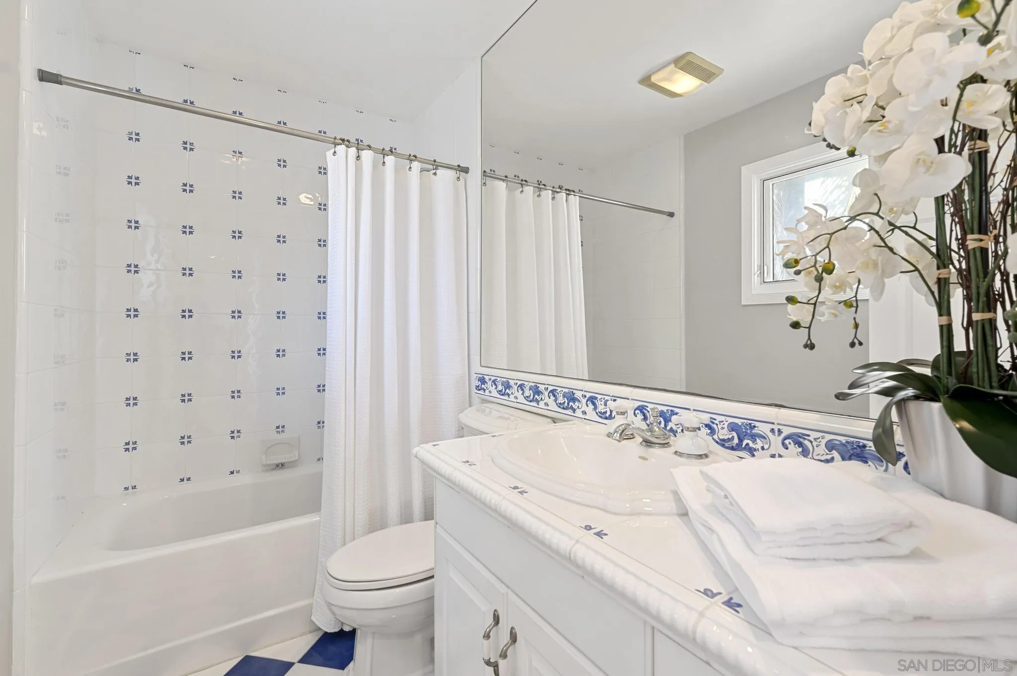 7231 Draper Avenue La Jolla, CA 92037 - Photo 20 of 26 a bathroom with a sink toilet and shower