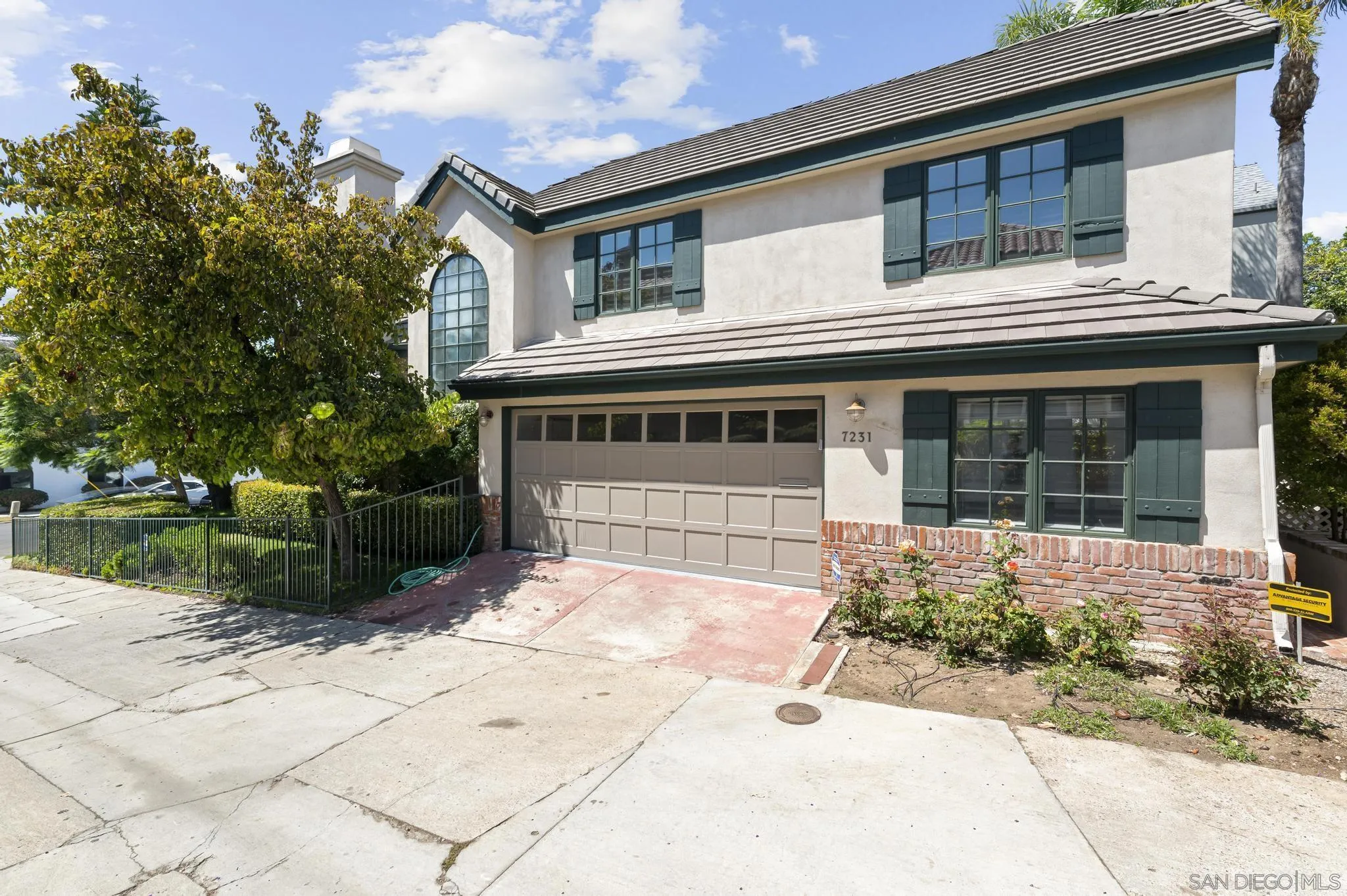 7231 Draper Avenue La Jolla, CA 92037 - Photo 22 of 26 a front view of a house with a garden and patio