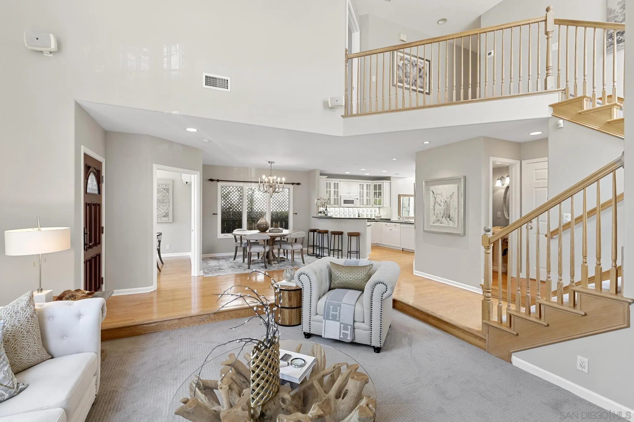 7231 Draper Avenue La Jolla, CA 92037 - Photo 4 of 26 a living room with furniture or couch and a dining table
