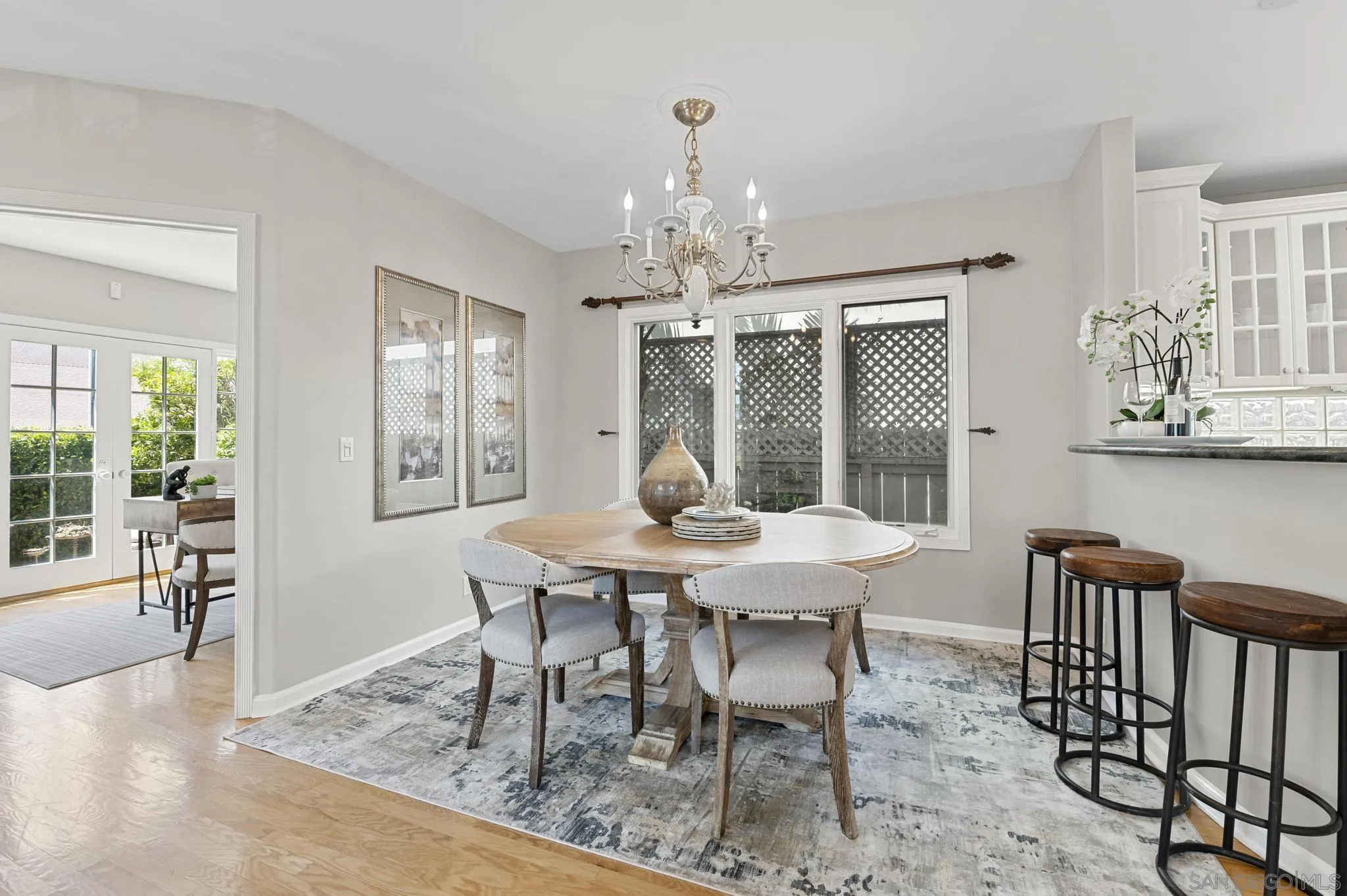 7231 Draper Avenue La Jolla, CA 92037 - Photo 6 of 26 a view of a dining room with furniture window and outside view