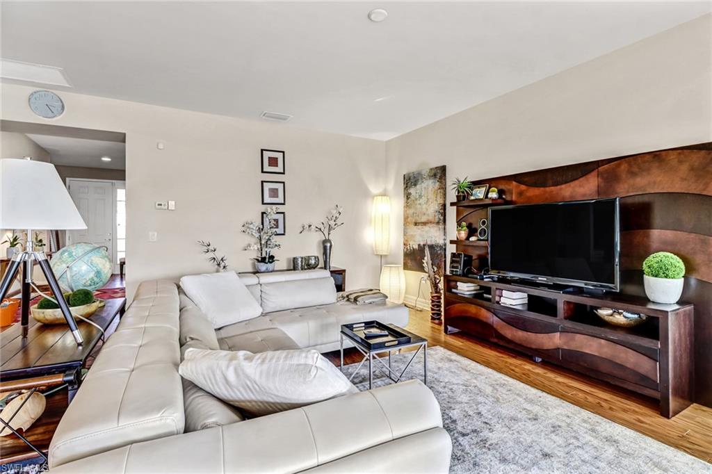 8416 Benelli Court Naples, FL 34114 - Photo 4 of 12 a living room with furniture and a flat screen tv
