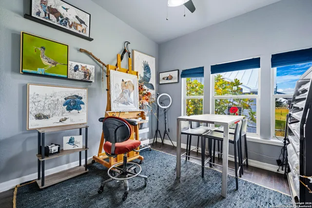 a living room with furniture a rug and a window