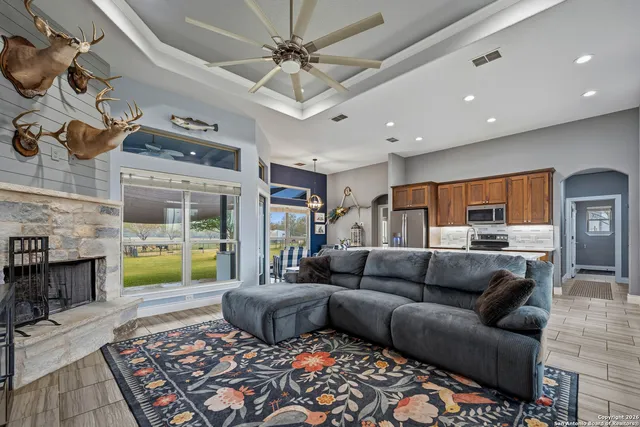 a living room with furniture and a fireplace