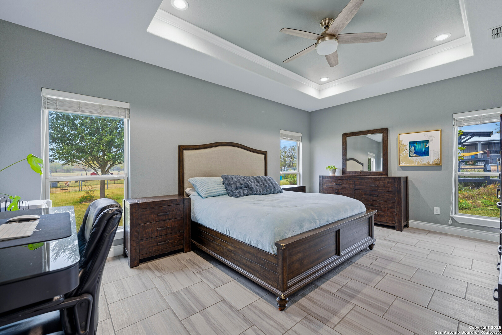 3585 Pittman Road St. Hedwig, TX 78152 - Photo 6 of 36 a spacious bedroom with a bed a table and windows