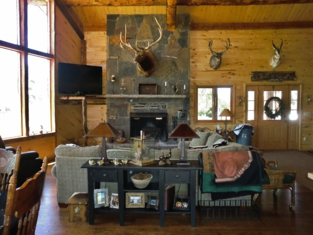 44291 90 Road Nucla, CO 81424 - Photo 12 of 25 a living room with fireplace furniture and a flat screen tv