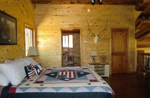 44291 90 Road Nucla, CO 81424 - Photo 20 of 25 a bedroom with a bed and a chandelier