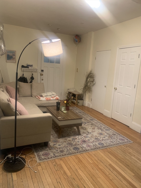 322 St Paul Street, Unit 1 Brookline, MA 02446 - Photo 2 of 9 a living room with furniture