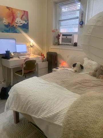 a large room with a bed and table