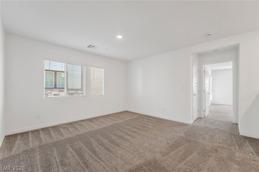 894 Cadence View Way Henderson, NV 89011 - Photo 13 of 23 A well-lit, open interior space awaits your personal touch.