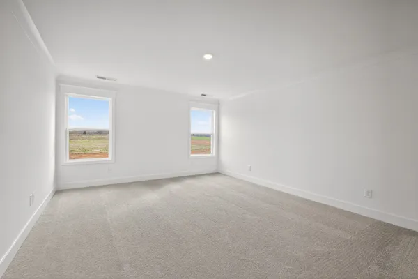 a bathroom with a shower and a glass door